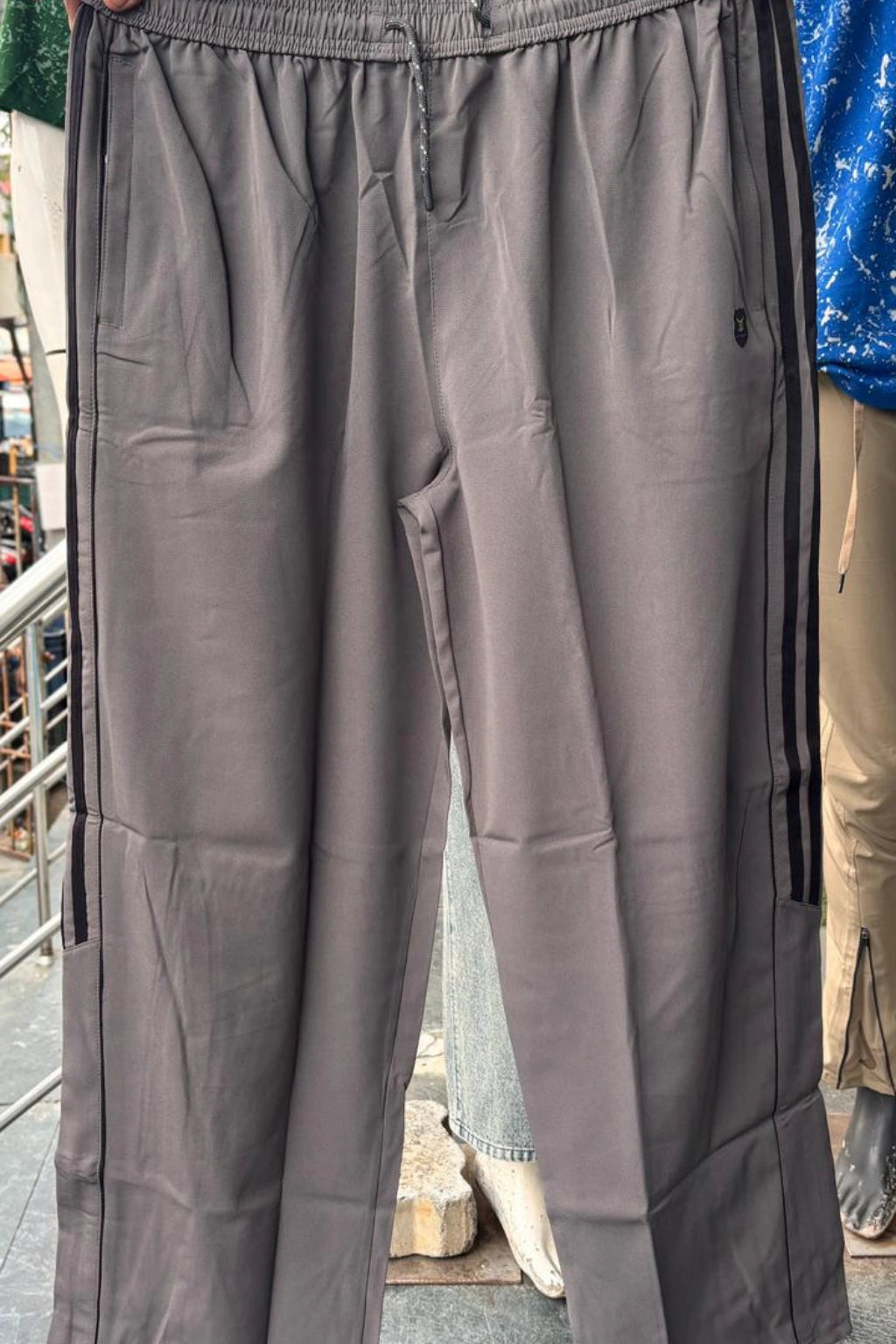 ShopTheBrandSpot plus size light grey baggy terry track pants for men made from breathable premium terry fabric, featuring adjustable drawstring waistband, side pockets, and relaxed oversized fit ideal for casual, travel, and everyday wear.