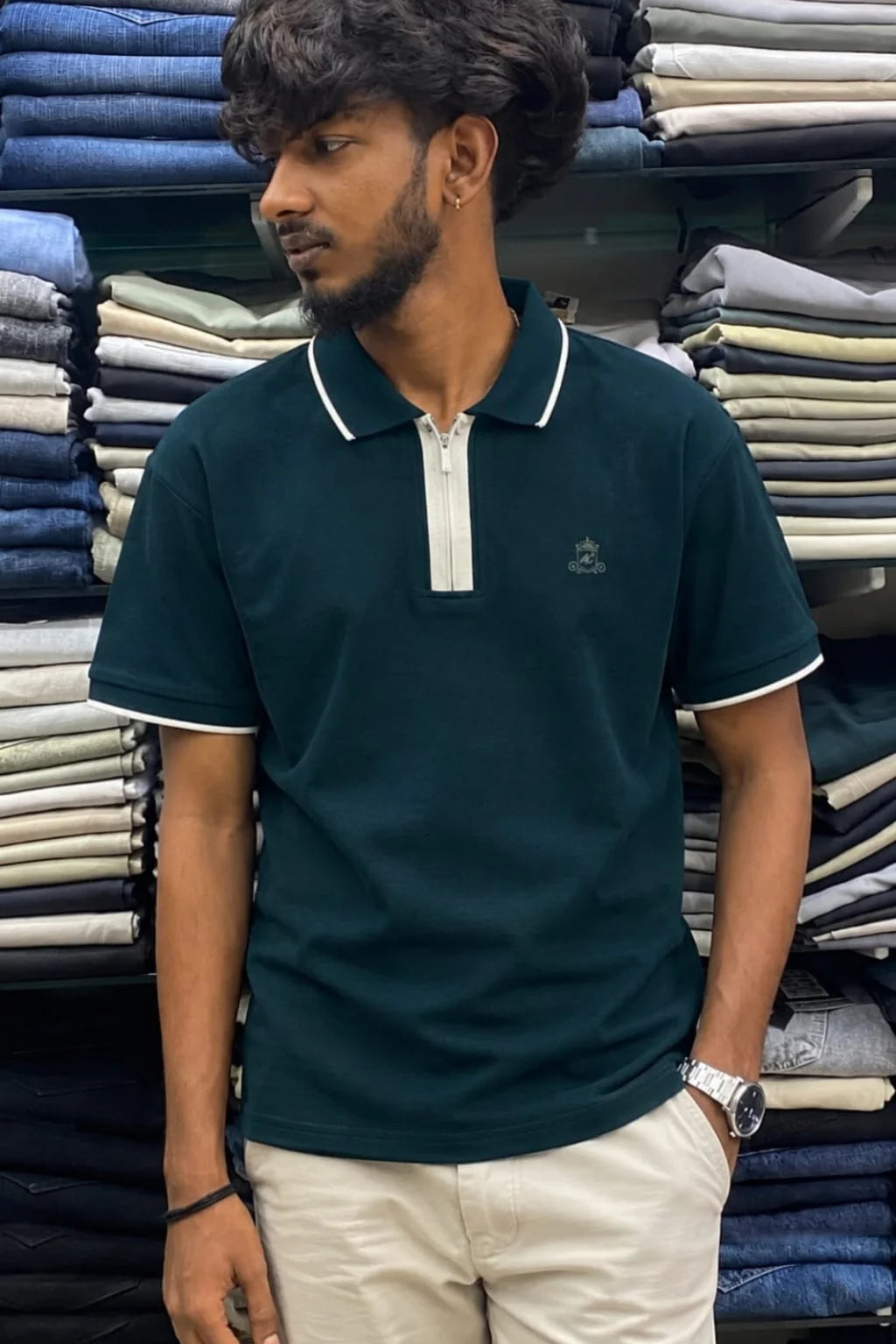 Men's zip collar polo t-shirt in Mariana Navy color variant paired with beige pants by The Brand Spot