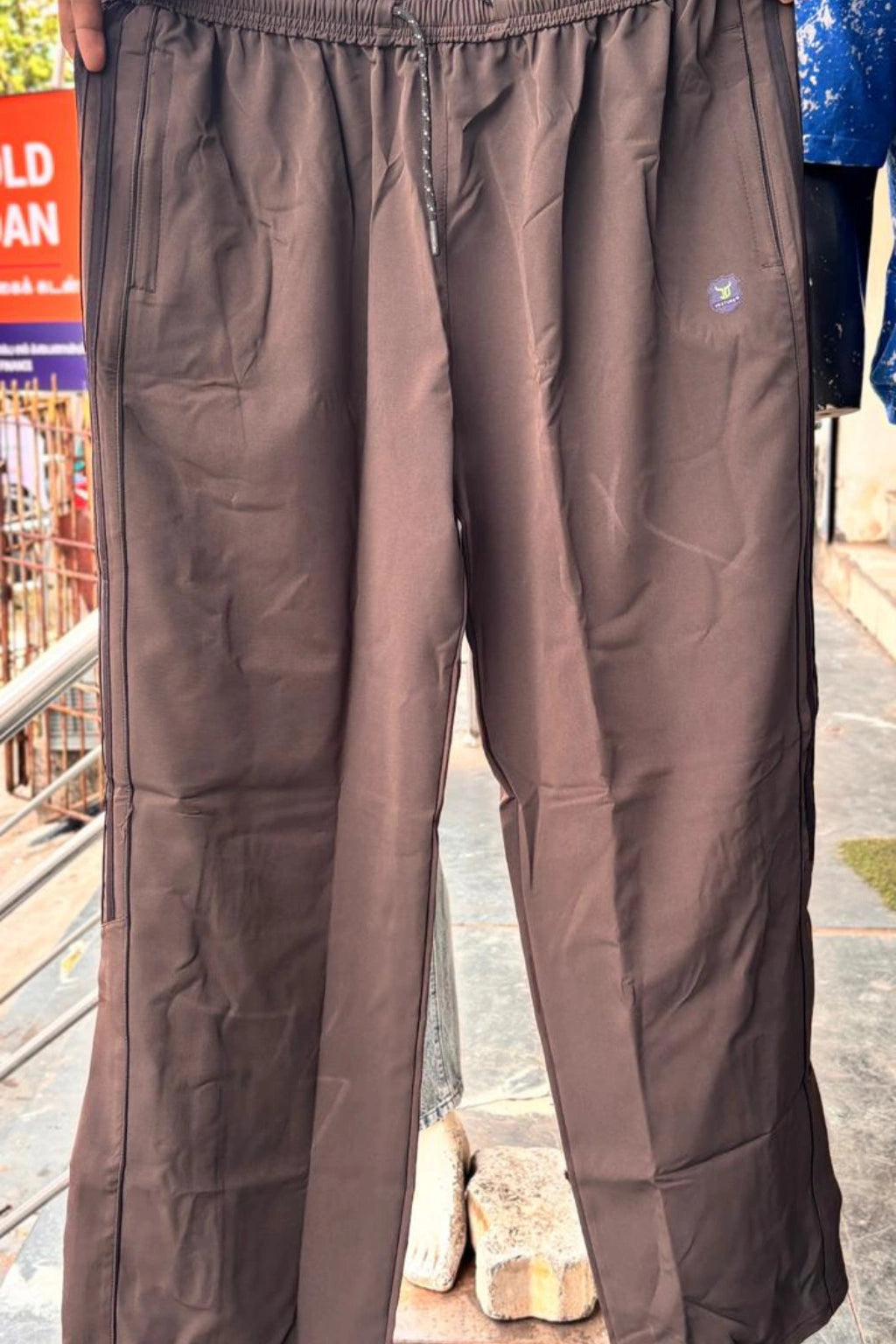 ShopTheBrandSpot plus size brown baggy terry track pants for men made from breathable premium terry fabric, featuring adjustable drawstring waistband, side pockets, and relaxed oversized fit ideal for casual, travel, and everyday wear.