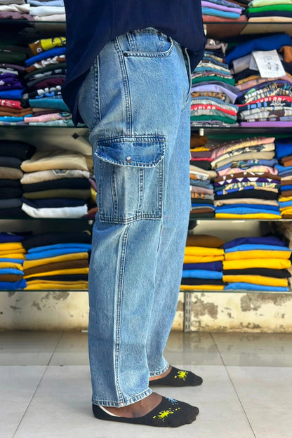 ShopTheBrandSpot plus size mid blue 6 pocket cargo jeans for men side view showing spacious thigh patch pockets, premium denim fabric, straight‑leg fit, and rugged casual style ideal for everyday comfort and streetwear fashion.