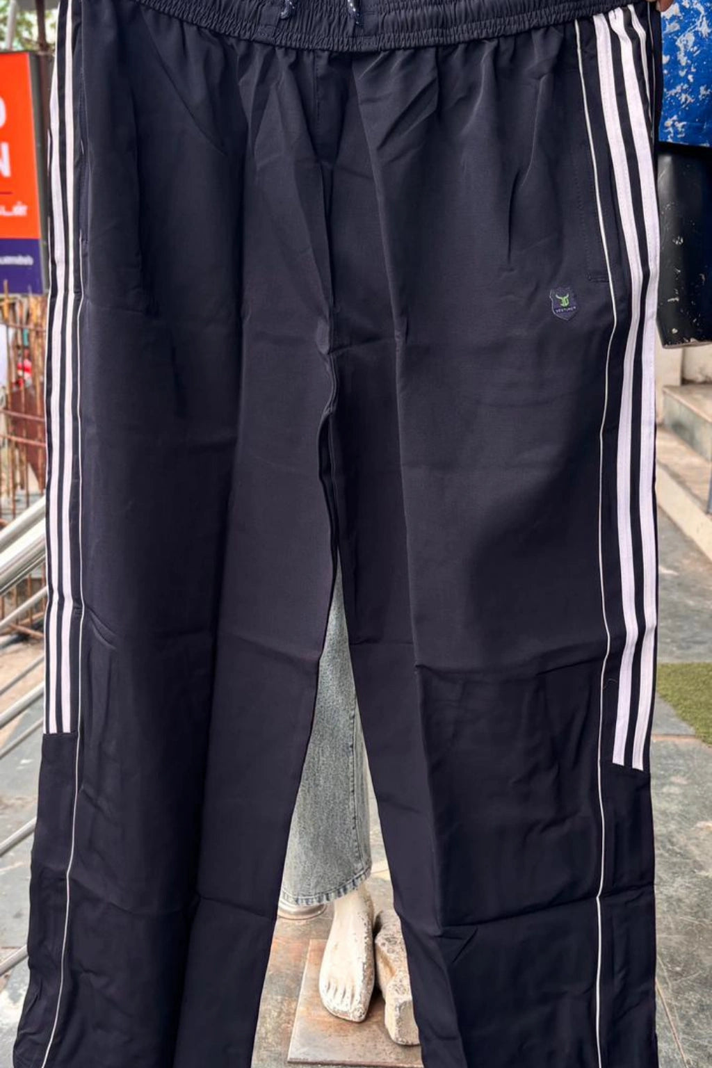 ShopTheBrandSpot plus size navy blue baggy terry track pants for men made from breathable premium terry fabric, featuring white side stripes, adjustable drawstring waistband, and relaxed oversized fit ideal for casual, travel, and everyday wear.