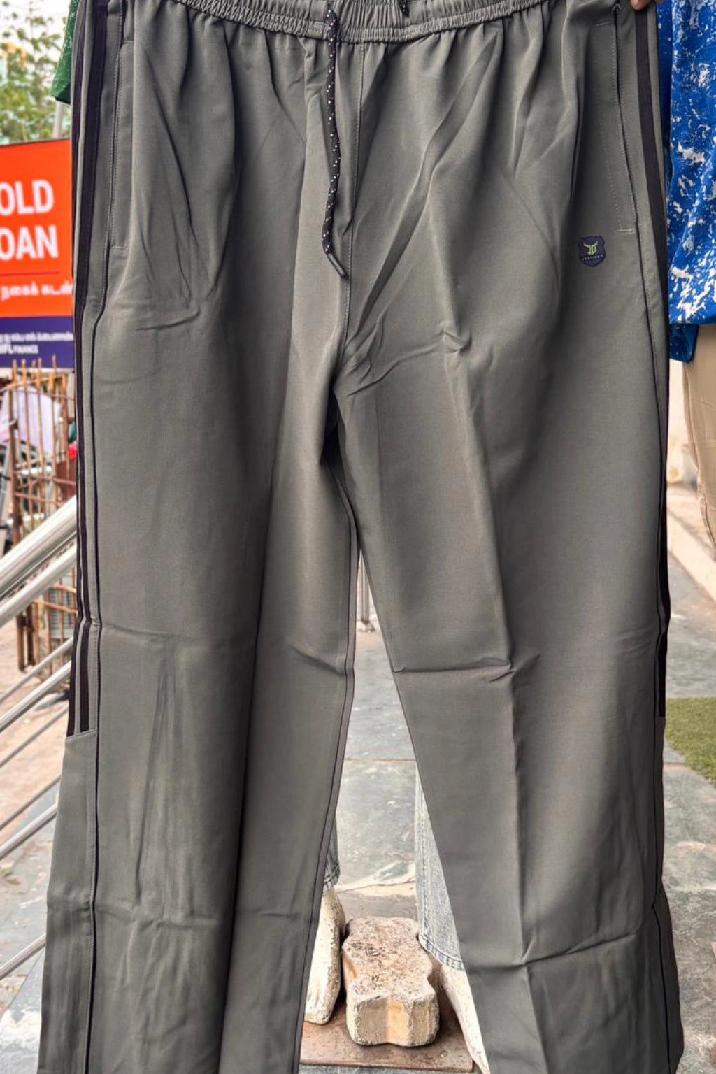 ShopTheBrandSpot plus size olive green baggy terry track pants for men made from breathable premium terry fabric, featuring adjustable drawstring waistband and relaxed oversized fit ideal for casual, travel, and everyday wear.