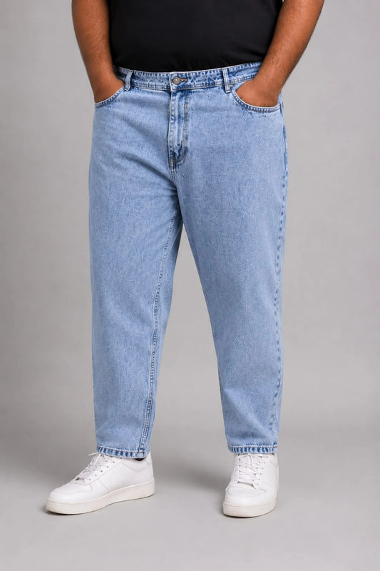 CloudySky Men's Mom Fit Jeans from TheBrandspot — high‑waist stretch denim in light‑blue shade, relaxed tapered fit for everyday comfort, styled with white sneakers; ideal for casual and office wear.