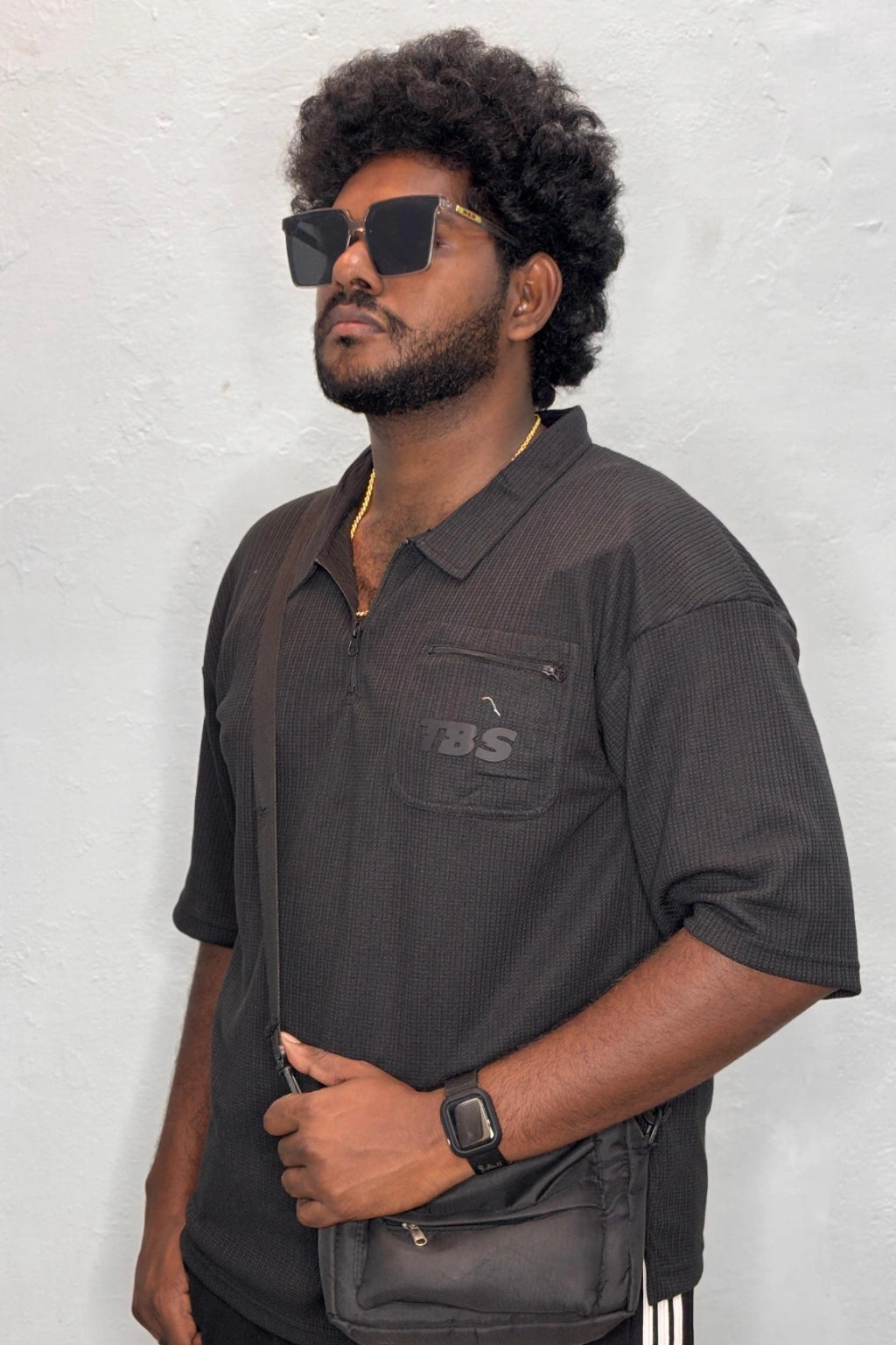 Side view of dark gray Korean down shoulder oversized polo t-shirt for men showing relaxed fit sleeve detail in sizes 3XL to 7XL by TheBrandSpot