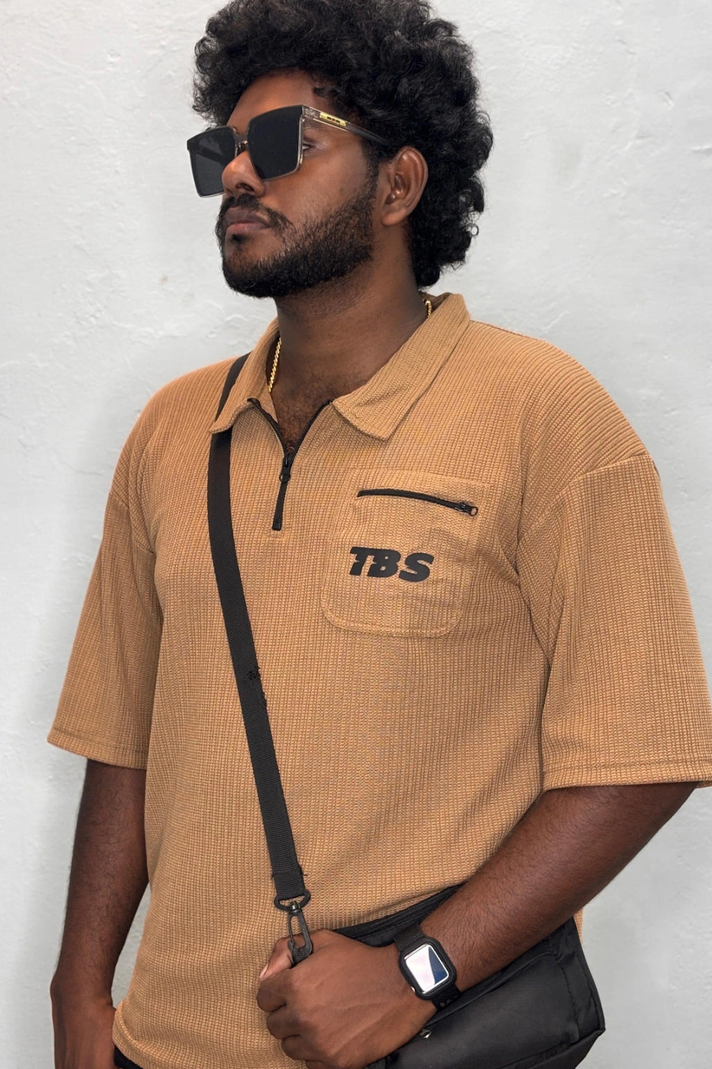 Side view of light biscuit color Korean down shoulder oversized polo t-shirt for men showing relaxed fit sleeve detail in sizes 3XL to 7XL by TheBrandSpot