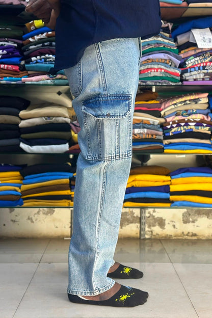 Side view of men's light blue 6 pocket cargo jeans showing spacious side utility flap pocket in sizes 38 and 40 by TheBrandSpot