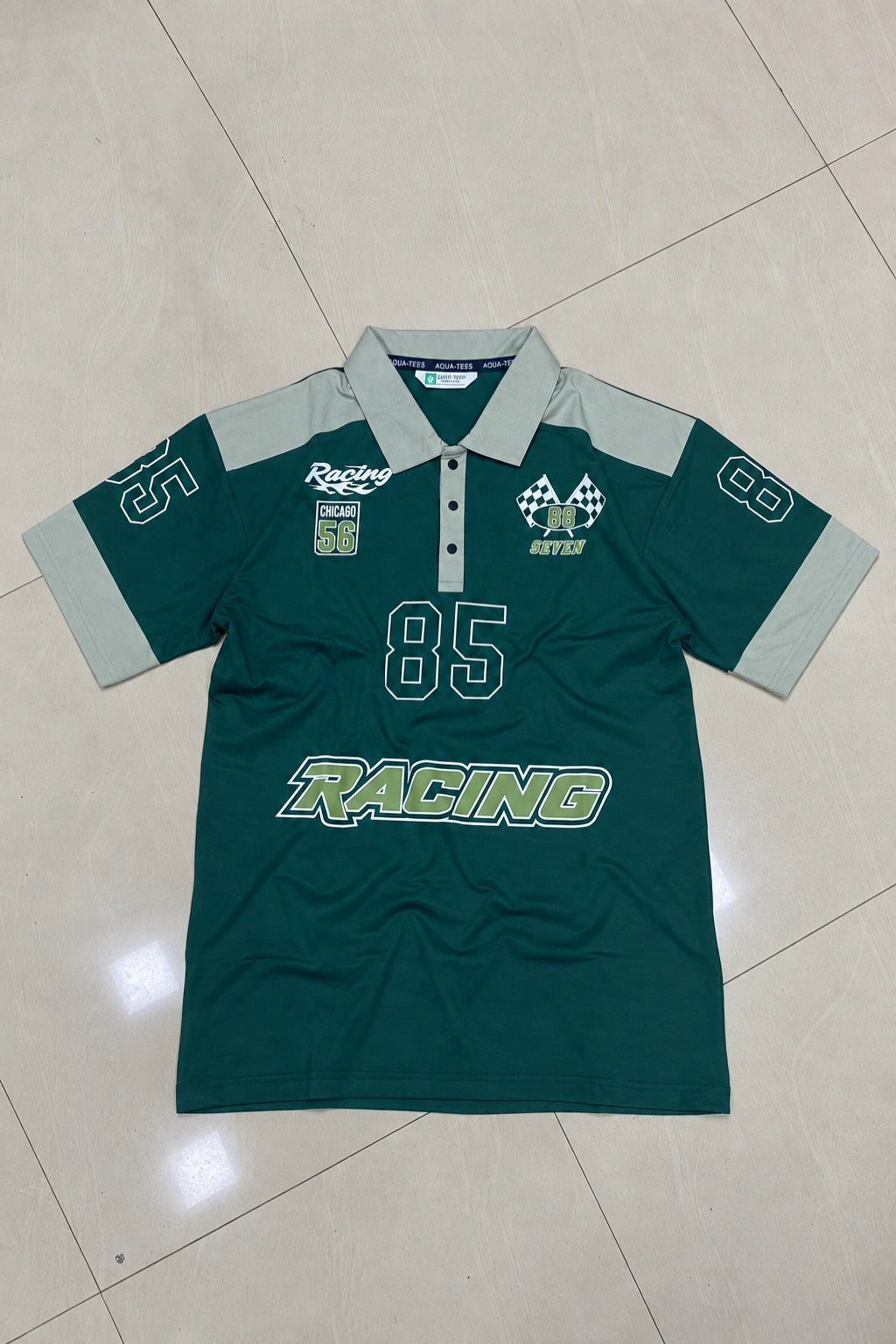 Men's graphic printed fake cotton polo t-shirt in ocean ink emerald green and grey with racing 85 print by The Brand Spot