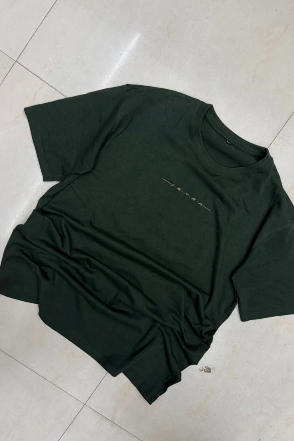 Front view of men's midnight green plus size t-shirt featuring minimalist chest text print in sizes 3XL to 6XL by TheBrandSpot