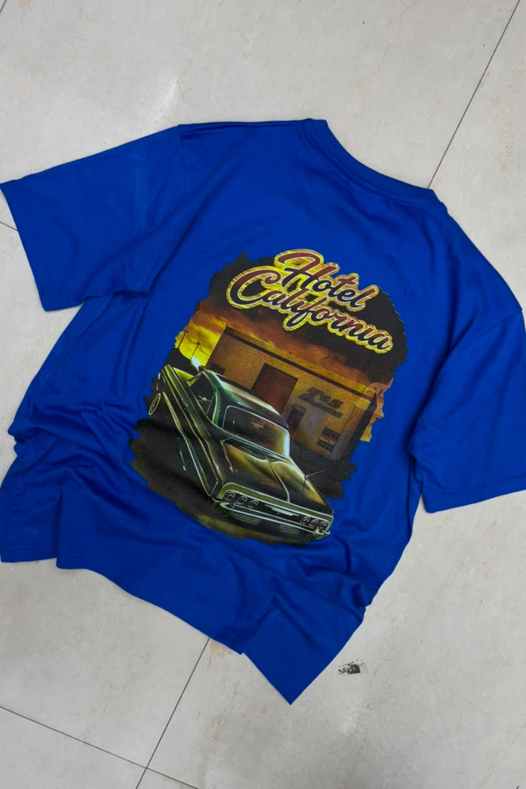 Back view of men's royal blue plus size t-shirt featuring Hotel California vintage car graphic artwork print in sizes 3XL to 6XL by TheBrandSpot