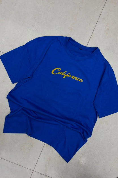 Front view of men's royal blue plus size t-shirt featuring yellow California chest script text print in sizes 3XL to 6XL by TheBrandSpot