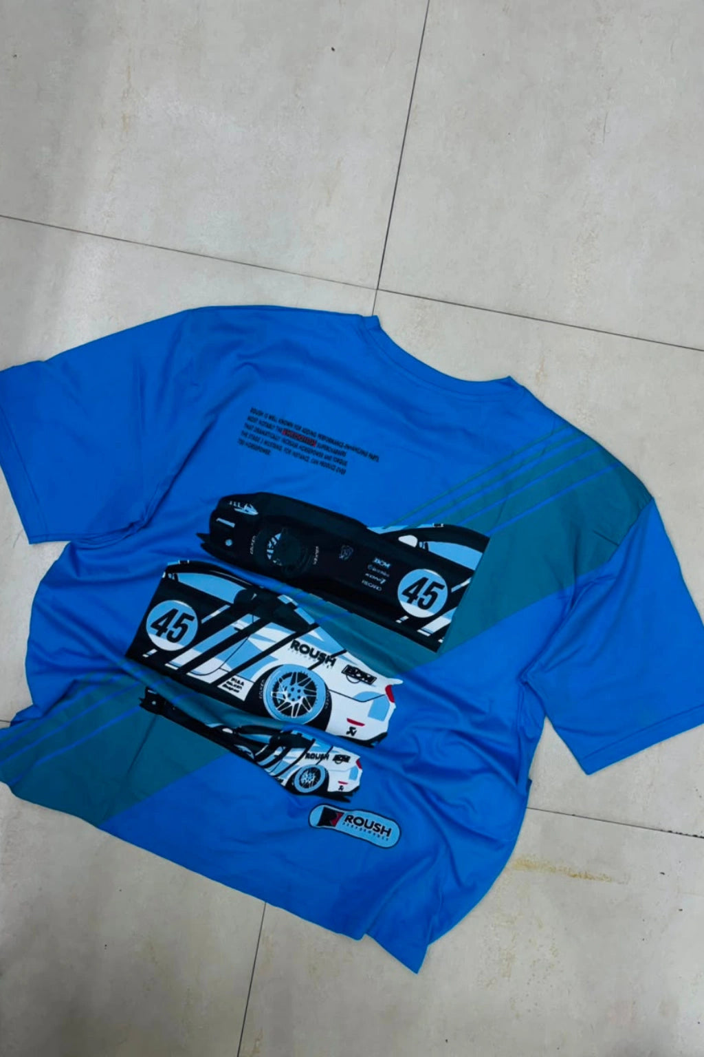 Back view of men's sapphire blue plus size t-shirt featuring race car graphic artwork print with racing stripes in sizes 3XL to 8XL by TheBrandSpot