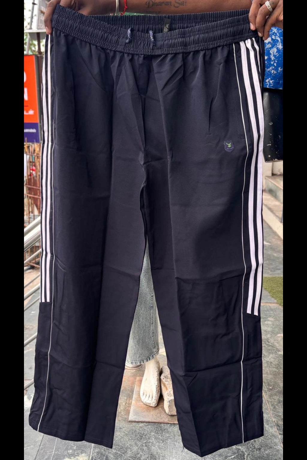 Men's navy blue plus size baggy terry track pants with side stripes and elastic waistband in sizes 3XL to 7XL by TheBrandSpot