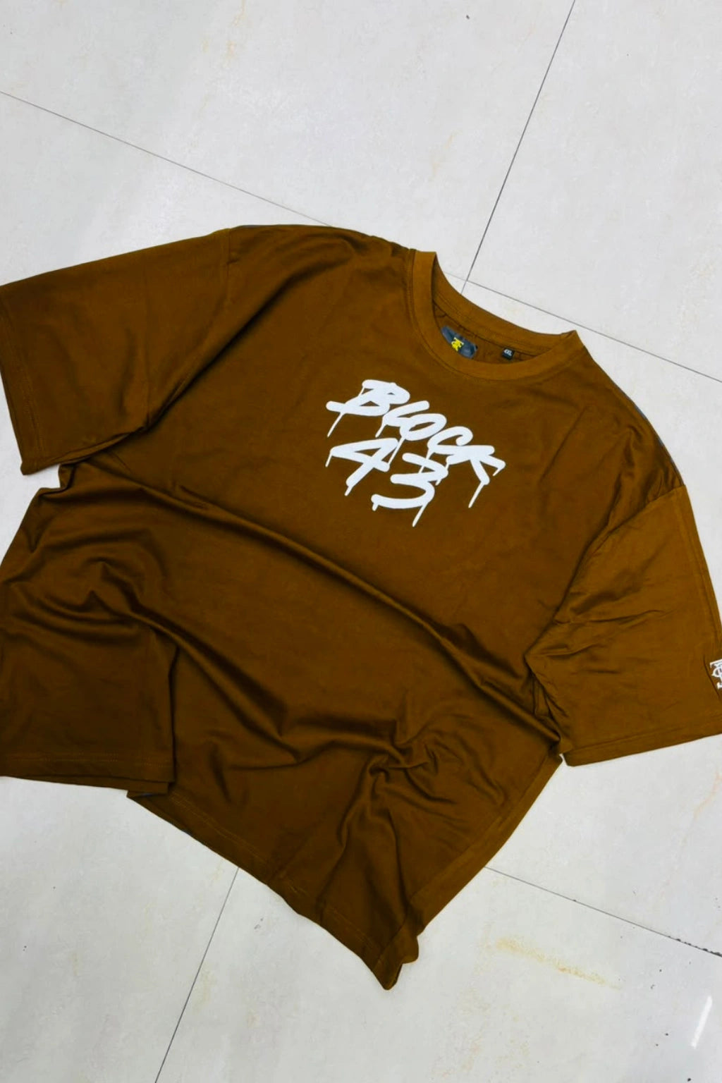 Front view of men's camel brown plus size t-shirt with BLOCK 43 chest graphic logo in sizes 3XL to 8XL by TheBrandSpot