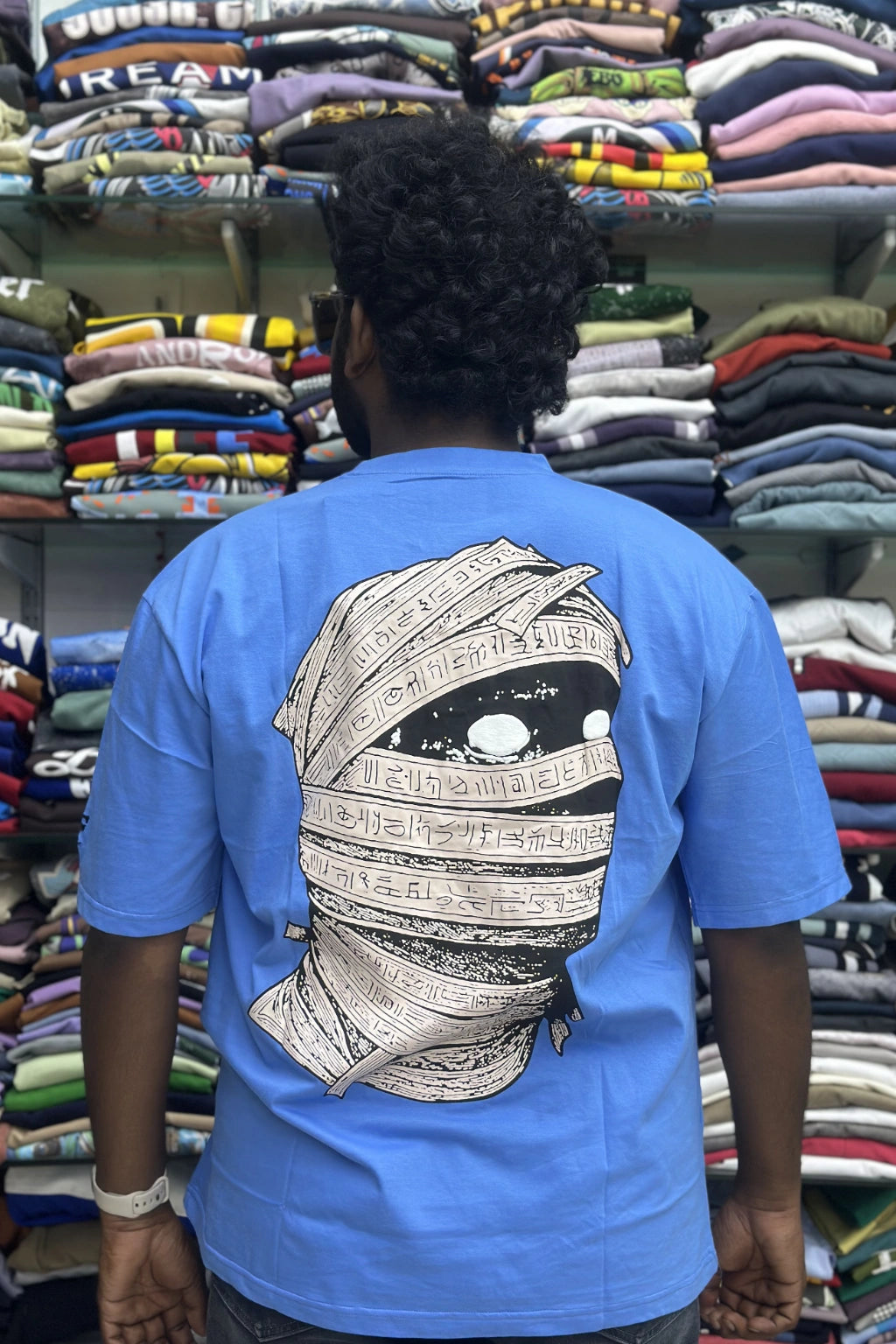 Back view of men's sky blue plus size half sleeve cotton t-shirt with Egypt mummy graphic print in sizes 5XL to 10XL by TheBrandSpot