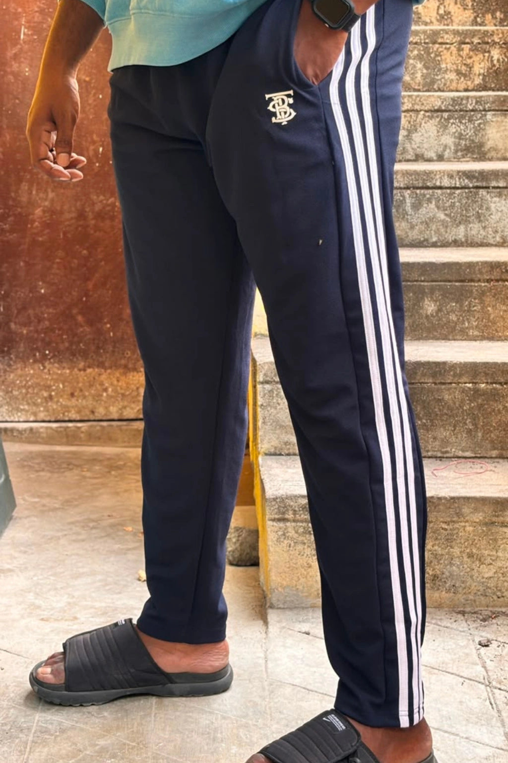 Men's dark navy blue striped plus size track pants with white side stripes and elastic waistband in sizes 2XL to 7XL by TheBrandSpot