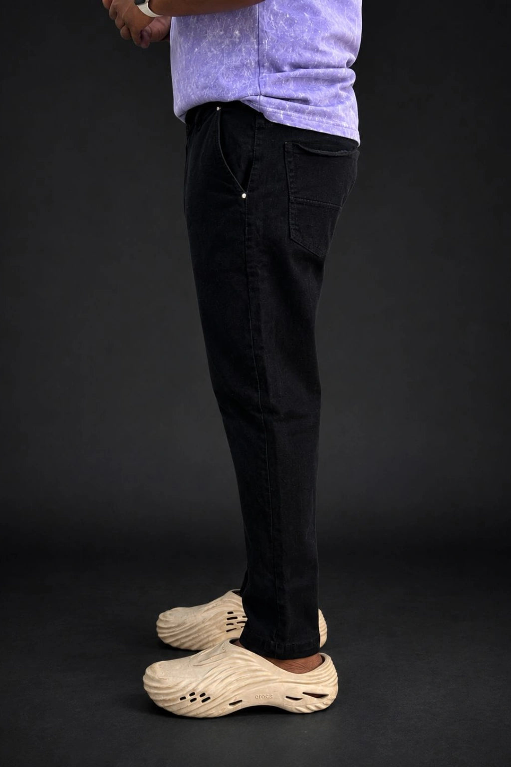 Side view of men's Z-black premium stretch jeans in tapered fit available in sizes 28 to 48 by TheBrandSpot