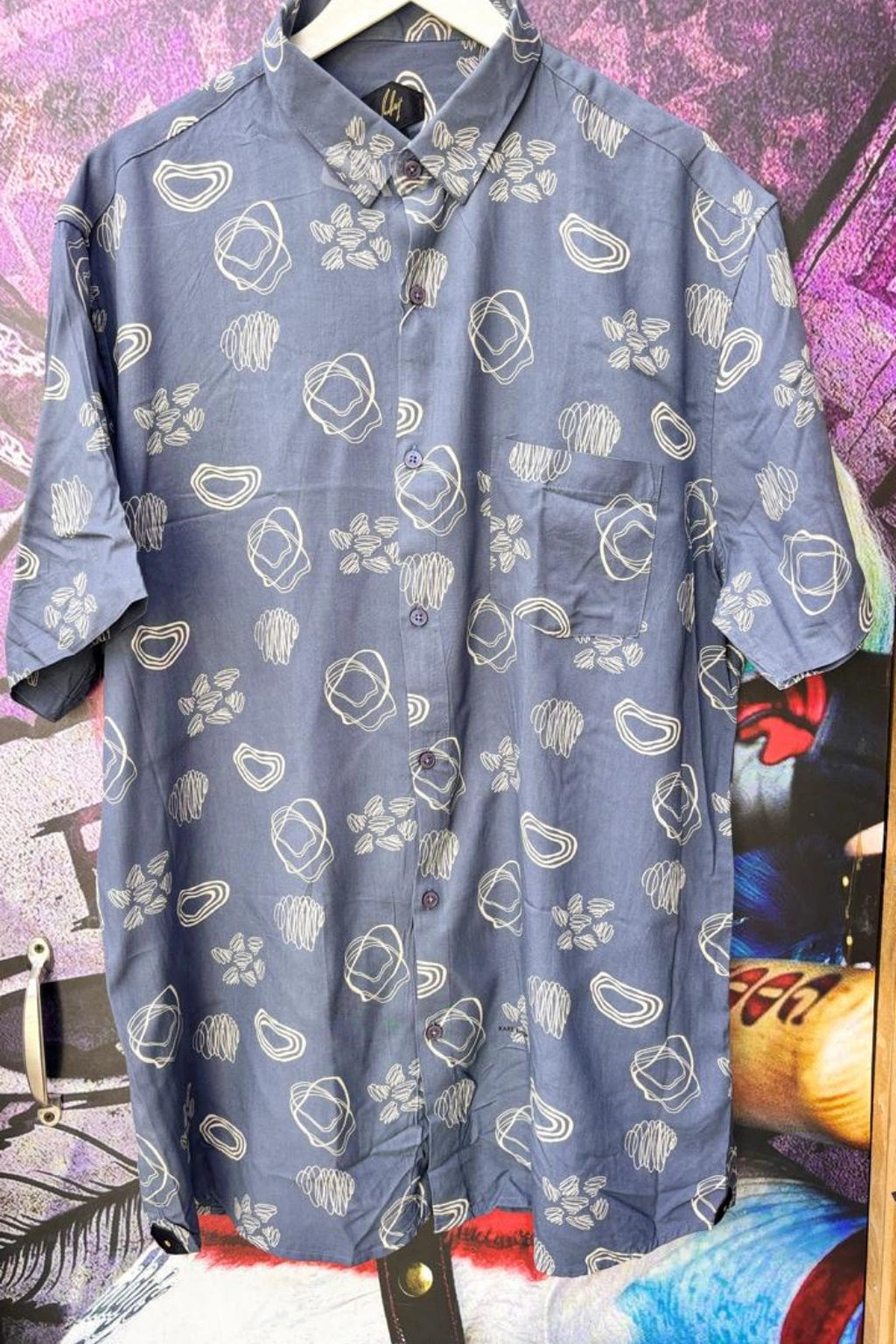 Steel Blue Plus Size Rayon Printed Half Sleeve Shirt for Men from TheBrandspot — premium rayon fabric with white geometric print on steel‑blue base, breathable and lightweight design for big and tall men (3XL–5XL); ideal for summer casual, holiday, and everyday wear.