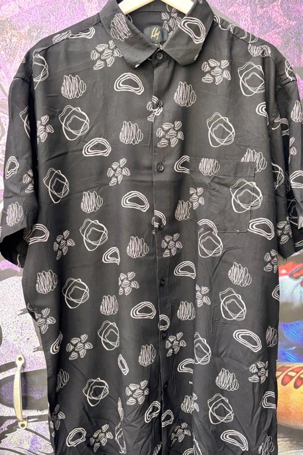 Stone Black Plus Size Rayon Printed Half Sleeve Shirt for Men from TheBrandspot — premium rayon fabric with white abstract print on black base, breathable and lightweight design for big and tall men (3XL–5XL); ideal for summer casual, holiday, and everyday wear.