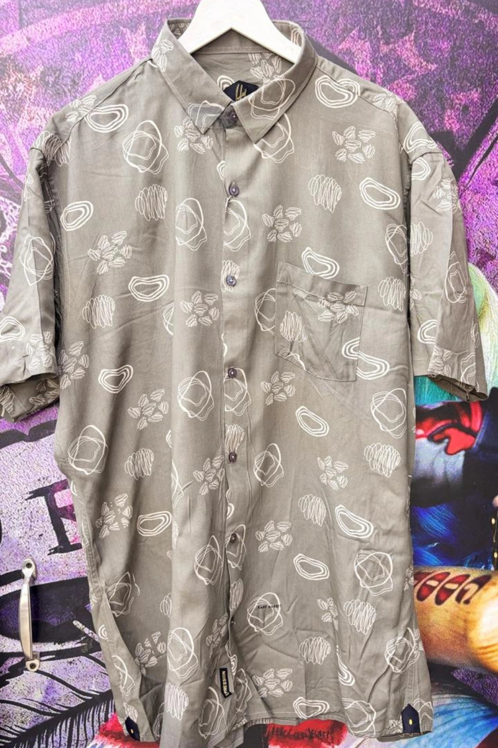 Urban Beige Plus Size Rayon Printed Half Sleeve Shirt for Men from TheBrandspot — premium rayon fabric with abstract floral print on beige‑gray base, breathable and lightweight design for big and tall men (3XL–5XL); ideal for summer casual, holiday, and everyday wear.