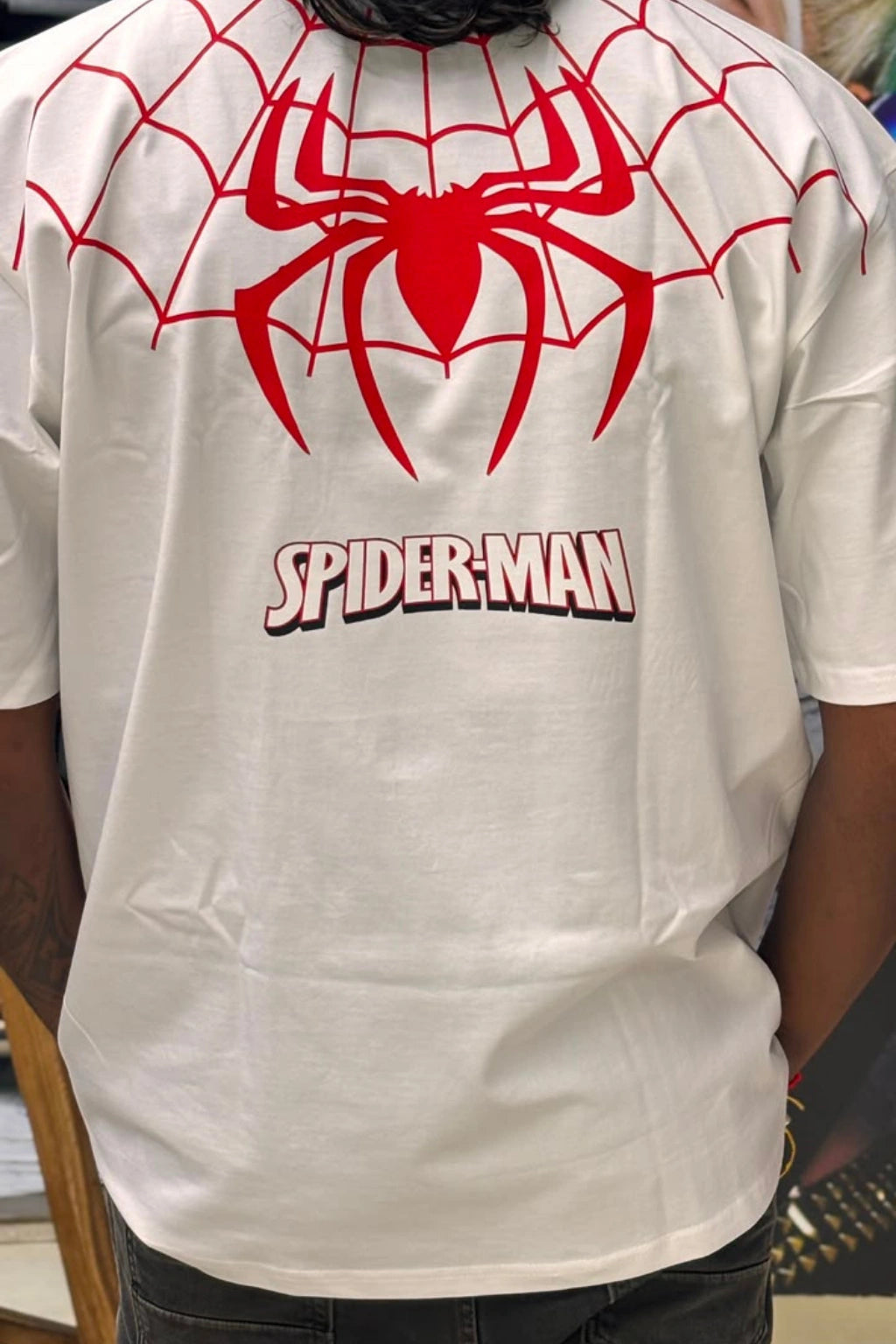 Back view of White Spiderman printed oversized t-shirt for men, featuring red spider web graphic and Spiderman logo on upper back, plus size 3XL